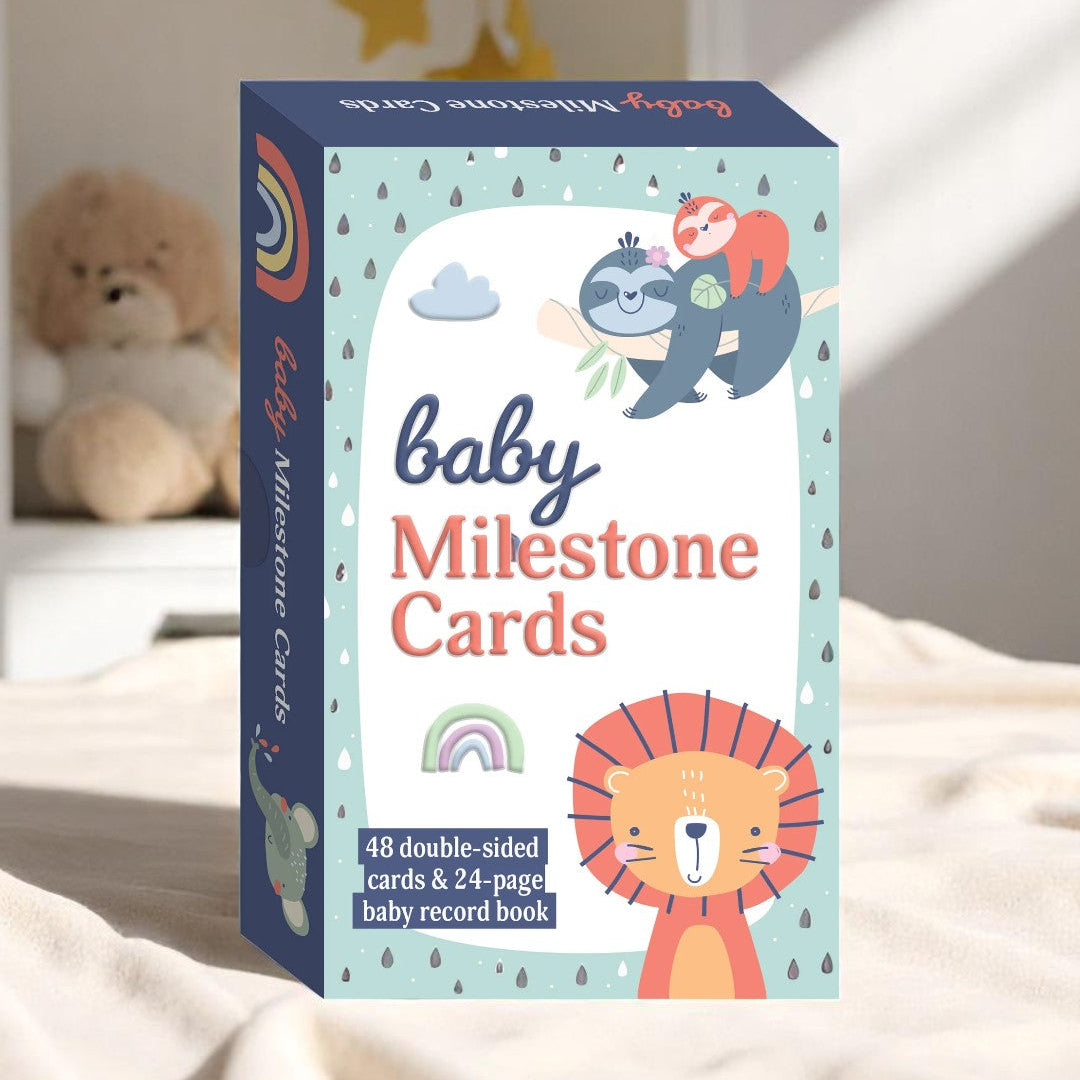A flatlay of baby milestone cards in soft, earthy colours with delicate fonts, shown beside a plush toy on a neutral background.