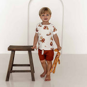 Toddler wearing organic cotton t-shirt with lion print ~ relaxed fit and breathable fabric.