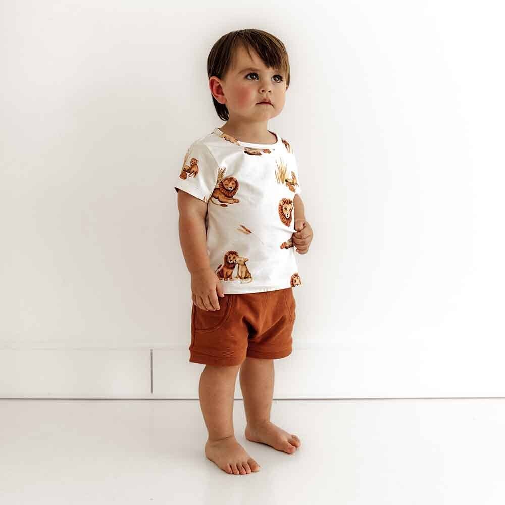 Toddler wearing organic cotton t-shirt with lion print ~ relaxed fit and breathable fabric.